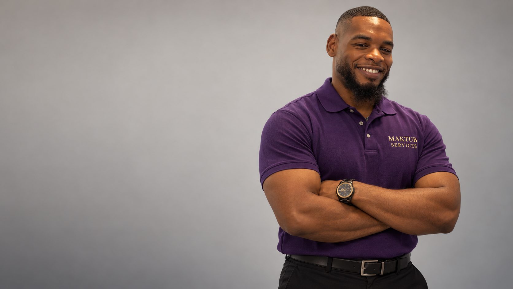 Obe, owner of Maktub Moving Services, in a purple Maktub polo